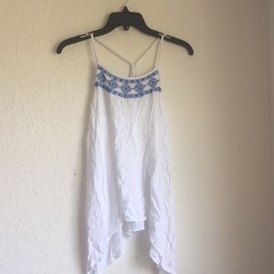 Royal blue and white loose, open crossed back top